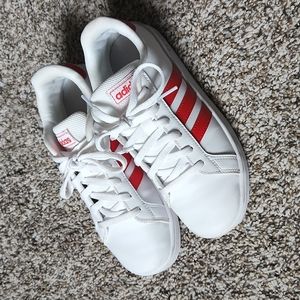 Adidas sneakers/tennis shoes. White and red striped.